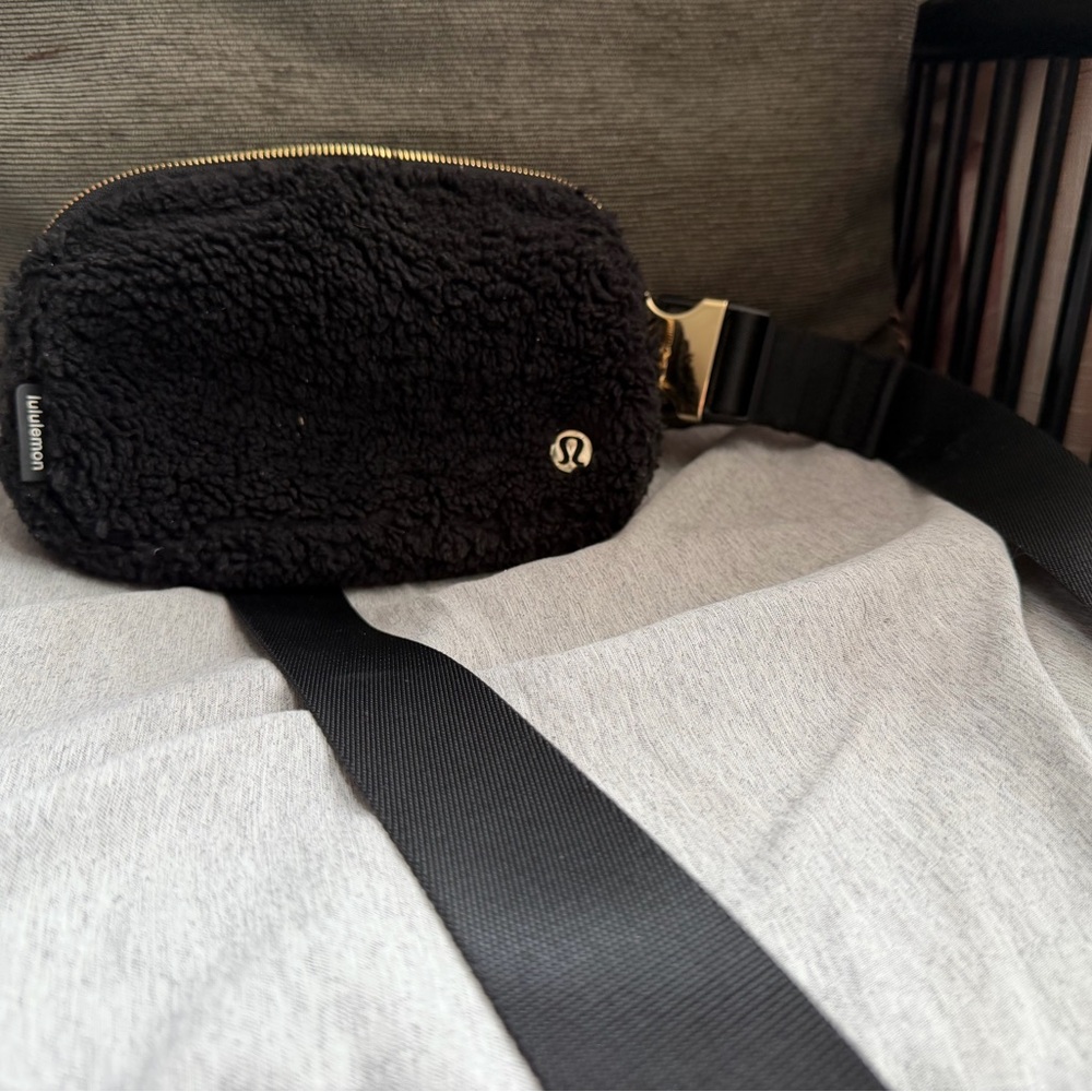 Lululemon Black Fleece Bag with Gold Accents
